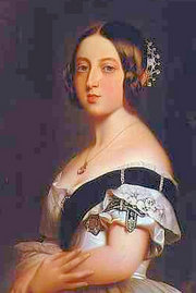 Queen Victoria wearing the Garter around her left arm.